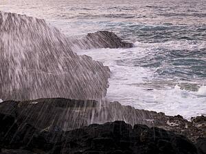 Water spray over the rocks, Kauai, Hawaii