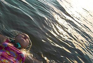 A girl floating on her back in the water