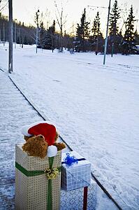Christmas presents beside a snow-covered road