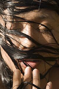 Close-up of a female's face with wet hair