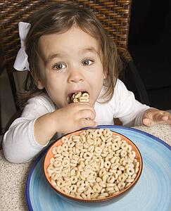 Girl eating bowl of cereal