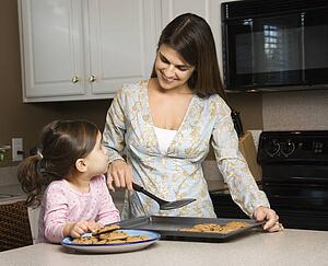Mother and daughter with cookies