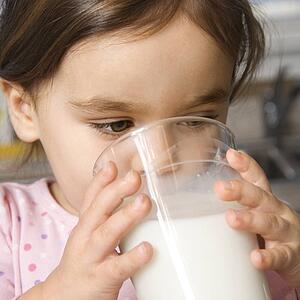 Girl drinking glass of milk