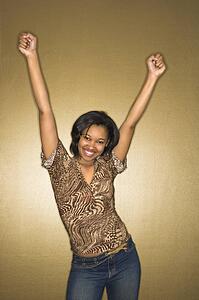 Happy female with arms in air