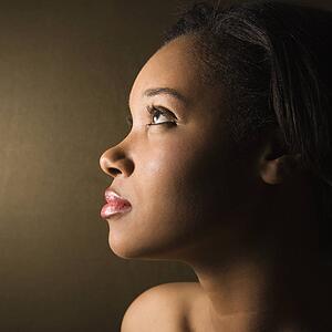 Profile of serious African-American young adult female.