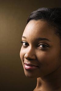 Smiling young adult female looking at viewer