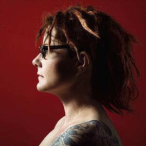Profile portrait woman with tattoos
