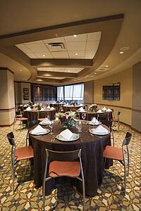 Restaurant interior with table setting and chairs