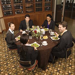 High angle of group of businesspeople in restaurant dining
