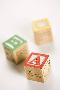 ABC alphabet blocks scattered on white background