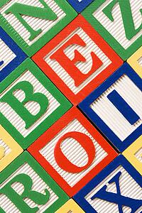 Alphabet building blocks neatly arranged.