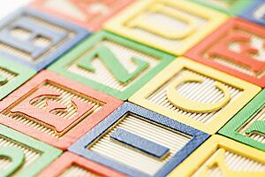 Alphabet building block toys arranged together