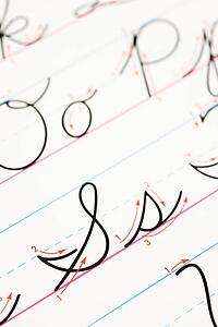 Close up of cursive handwriting practice page.