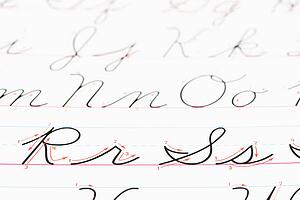 Close up of cursive handwriting practice page.