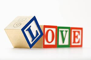 Alphabet toy building blocks spelling the word love.