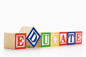 Alphabet toy building blocks spelling the word educate