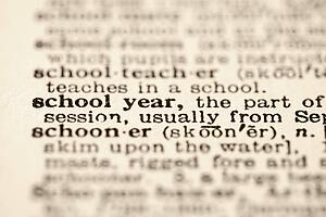 Selective focus of dictionary definition for school year.