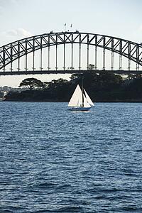 Sydney Harbour Bridge and sailboat in Sydney, Australia