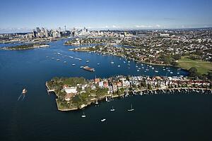 Aerial view of boats in Snails Bay with view of downtown skyline in Sydney, Australia
