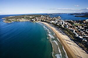 Aerial view of beachfront buildings and ocean in Sydney, Australia