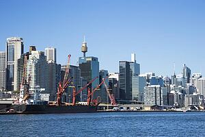 Downtown Sydney, Australia with view of cargo ship and harbour. 