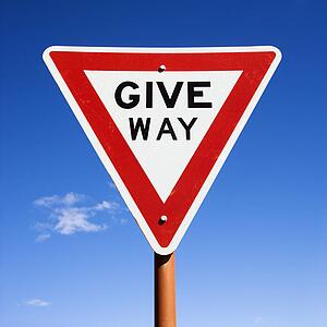 Humorous road sign reading Give Way in Australia