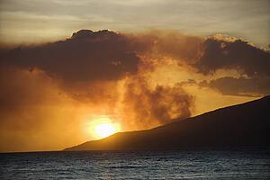 Dark clouds at sunset over water on Maui, Hawaii.