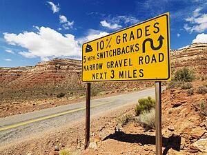 Road sign warning steep grade in Utah mountainous area