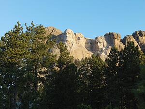 Mount Rushmore National Memorial seen through trees