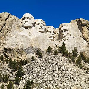 Mount Rushmore National Memorial with mountain and trees