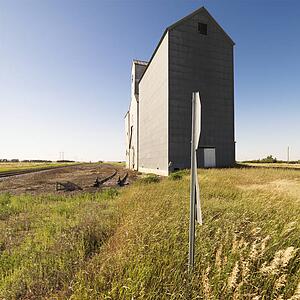 Agricultural grain elevator in rural field