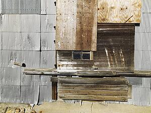 Building exterior with wood and metal siding