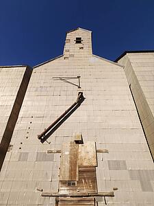 Low angle of abandoned metal grain elevator