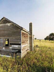 Abandoned rural wooden house in state of disrepair