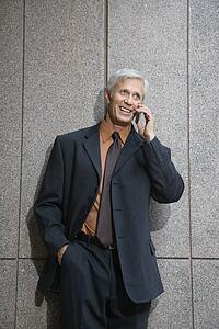 Businessman on cell phone smiling
