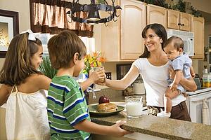 Family in kitchen with breakfast 