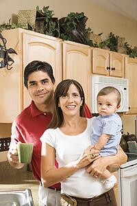 Family in home kitchen with baby 