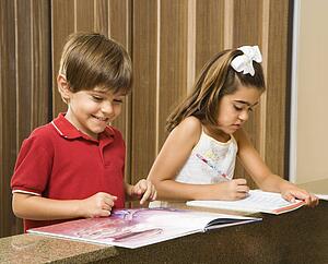 Brother and sister doing homework