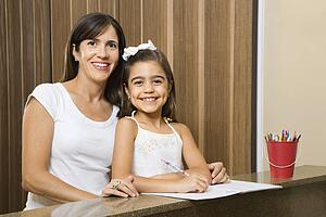 Mother and daughter portrait with homework