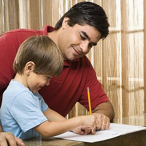 Father helping son with homework