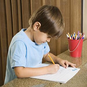 Boy concentrating on homework
