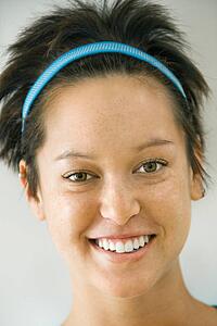 Headshot of smiling young Caucasian woman with short brown hair.