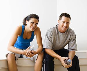 Woman and man sitting wearing active wear
