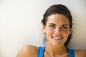 Woman in fitness attire smiling
