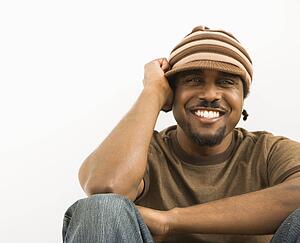 Man wearing knit hat smiling