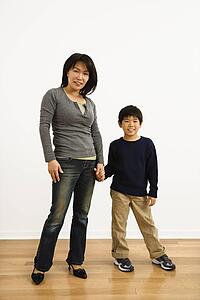 Mother and son holding hands
