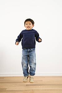 Young boy jumping and smiling