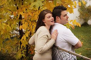 Woman trying to pull a man astray 