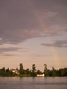 Lake of the Woods, Ontario, Canada, rainbow over a lake