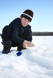 Boy ice fishing